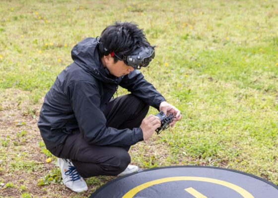 Kenji is checking a microdrone